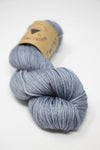 Madelinetosh Tosh DK yarn in Aura color, showing soft, hand-dyed wool yarn with subtle variegation and rich texture.