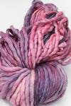Malabrigo Rasta merino wool yarn in a vibrant purple color, showcasing thick, soft, hand-dyed yarn for knitting or crochet projects.