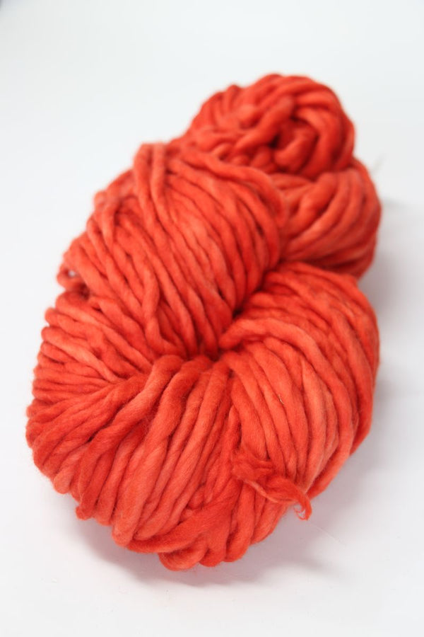 Colorful Malabrigo Rasta merino wool yarn in Fiesta shade, showcasing thick, soft, and vibrant fiber for knitting and crochet projects.