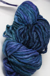 Bright blue Malabrigo Rasta merino wool yarn ball with soft, chunky texture, perfect for knitting or crochet projects.