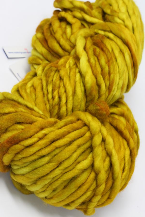 Malabrigo Rasta merino wool yarn in frankochre color, showing thick, soft, hand-dyed yarn for knitting or crochet projects.