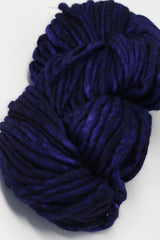 Purple Malabrigo Rasta Merino Wool Yarn skein with soft, thick, and textured fibers perfect for knitting or crochet projects.