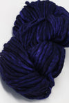 Purple Malabrigo Rasta Merino Wool Yarn skein with soft, thick, and textured fibers perfect for knitting or crochet projects.