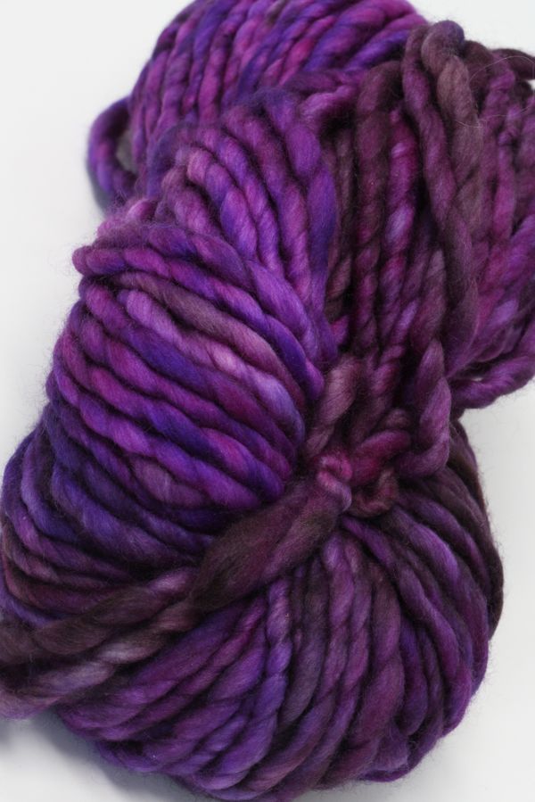 Brightly colored Malabrigo Rasta Merino Wool Yarn skein showing vibrant stripes and soft texture for knitting or crochet projects.