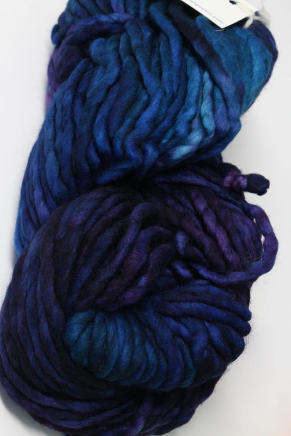 Malabrigo Rasta Merino Wool Yarn in Whales Road color, showing thick, textured yarn with vibrant blue and teal shades.