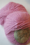 Plymouth Angora Yarn in bubblegum pink, soft and fluffy knitting yarn with a smooth texture and vibrant color.