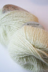 Plymouth Angora knitting yarn in celery color, soft and fluffy fiber suitable for cozy handmade garments and accessories.