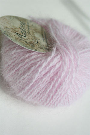 Soft pink Plymouth Angora Yarn skein showcasing fluffy texture and vibrant color, ideal for knitting projects.