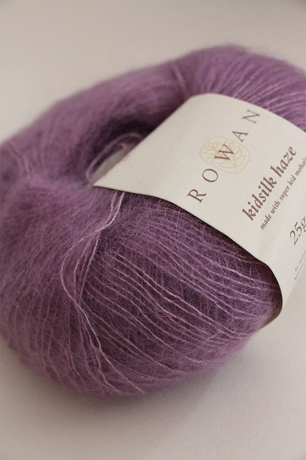Soft, multicolor Rowan Kidsilk Haze yarn ball with a delicate, fuzzy texture, perfect for knitting or crocheting cozy garments.