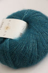 Rowan Kidsilk Haze yarn in peacock color, soft and lightweight silk and mohair blend ideal for knitting and crochet projects.