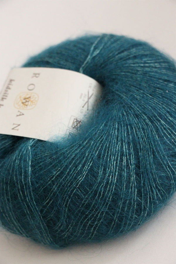 Rowan Kidsilk Haze yarn in peacock color, soft and lightweight silk and mohair blend ideal for knitting and crochet projects.
