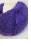 Soft, colorful skeins of Rowan Kidsilk Haze yarn in velvet shades, showcasing the delicate, lightweight fiber for knitting or crochet projects.