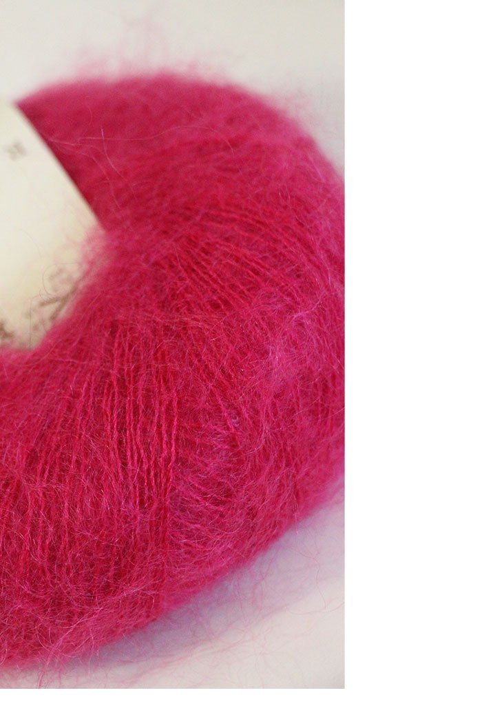 Soft, multicolored Rowan Kidsilk Haze yarn skein showcasing its delicate, fuzzy texture and vibrant pastel shades.