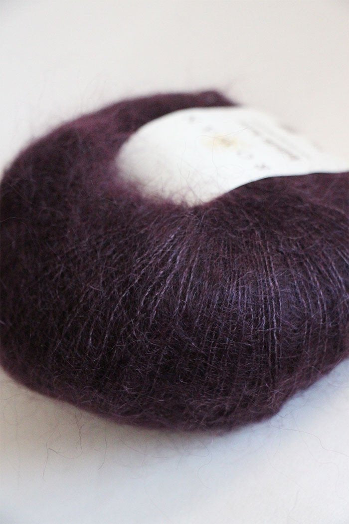 Black Currant Rowan Kidsilk Haze yarn ball showcasing soft, lightweight, multi-purpose knitting and crochet silk and mohair blend.