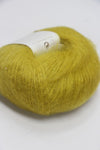 Rowan Kidsilk Haze yarn ball in eve green color, soft and lightweight blended silk and mohair for knitting or crochet projects.