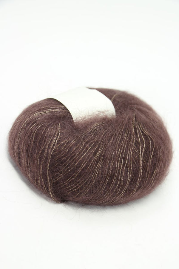 Soft Rowan Kidsilk Haze yarn in bark color, showcasing delicate, lightweight fiber ideal for knitting and crochet projects.