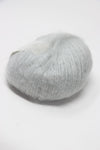 Soft, multicolored Rowan Kidsilk Haze yarn skein in pastel shades, ideal for knitting and crochet projects.