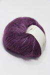 Purple Rowan Kidsilk Haze yarn skein showing soft, silky fibers ideal for delicate knitting and crochet projects.
