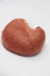 Rowan Kidsilk Haze yarn in Burnt Caramel color, soft and lightweight with a delicate, fuzzy texture suitable for knitting or crochet projects.