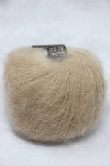 Soft, shimmering Rowan Kidsilk Haze yarn in a lustrous, delicate fiber with subtle color variations for knitting or crochet projects.