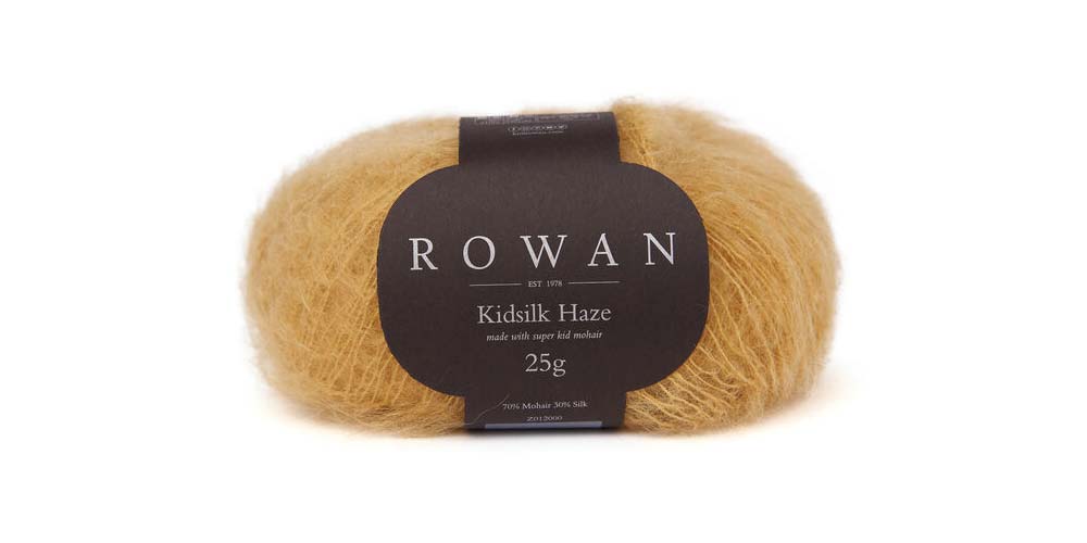 Soft orange Rowan Kidsilk Haze yarn ball, lightweight and delicate for knitting or crochet projects.