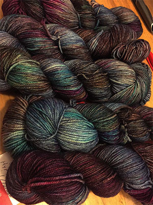 Zen Yarn Garden Serenity 20 fingering weight yarn in hypnotic colorway, showcasing vibrant, hand-dyed fiber for knitting or crochet projects.