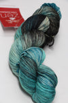 Fingering weight yarn Zen Yarn Garden Serenity 20 in jetsetter colorway, soft fiber with rich, variegated purple and gray tones.