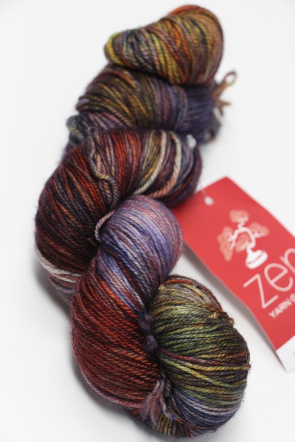 Close-up of Zen Yarn Garden Serenity 20 fingering weight yarn in vibrant eclipse colorway, showcasing soft texture and fine fibers.