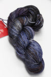 Close-up of Zen Yarn Garden Serenity 20 fingering weight yarn in moody shades, showcasing soft, textured fibers for knitting or crochet.