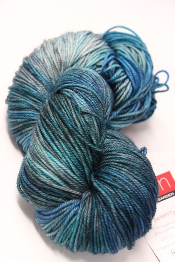 Fingering weight yarn from Zen Yarn Garden's Serenity 20 collection in Atlantis colorway, showcasing soft, vibrant fiber.
