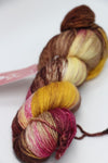 Fingering weight yarn from Zen Yarn Garden's Serenity 20 collection in vibrant color with soft, smooth texture and subtle color variations.