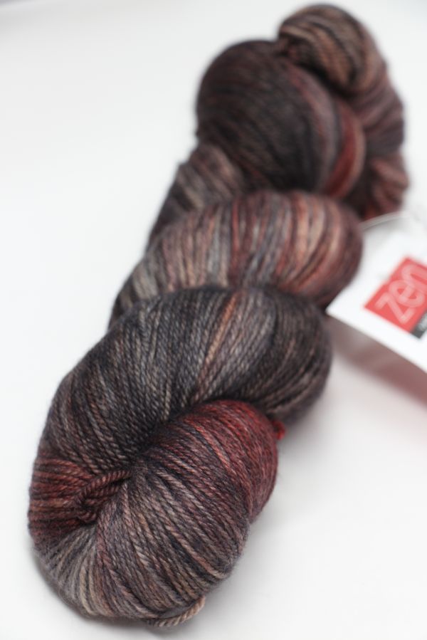Fingering weight Serenity 20 yarn by Zen Yarn Garden in rich mahogany color, showcasing soft, high-quality fiber and vibrant hue.