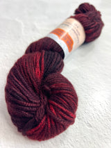 Red Jade Sapphire 8 Ply Cashmere yarn ball from Jade Sapphire Cashmere, showcasing soft, luxurious bright red cashmere fibers.