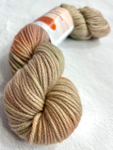 Jade Sapphire 8 ply cashmere yarn in stone hue, showing soft, smooth texture and tightly spun fibers for luxurious knitting projects.