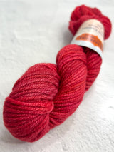 Jade Sapphire Cashmere 8 Ply Cashmere Yarn in vibrant red, showcasing soft, high-quality yarn with a smooth texture.
