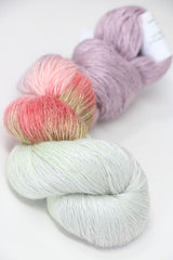 Soft Artyarns Ensemble Light cashmere yarn in F Series colors, showing multiple vibrant yarn skeins with rich textures.