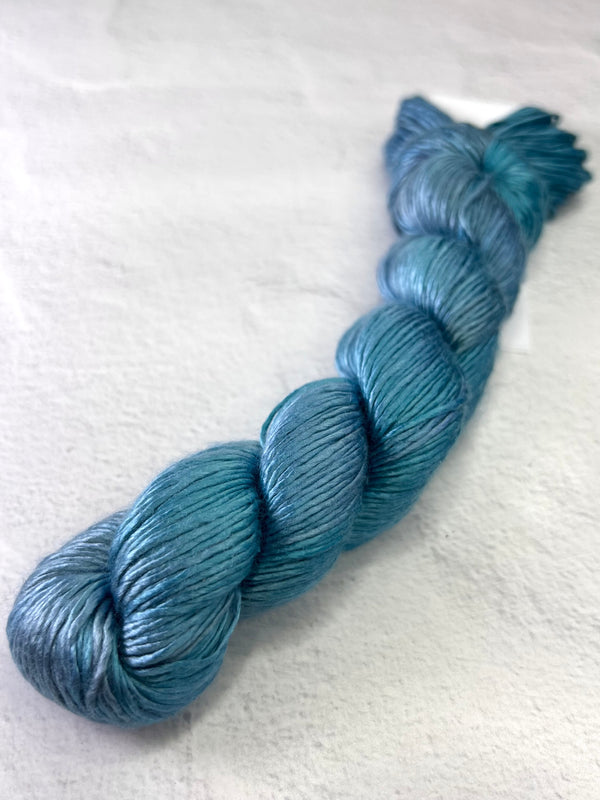 Artyarns Regal Silk Yarn H Series in vibrant, glossy silk strands suitable for knitting or crochet projects.