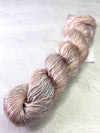 Close-up of Artyarns Regal Silk Yarn H Series in vibrant, shiny silk strands showcasing its luxurious texture and rich color highlights.