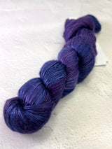 Close-up of Artyarns Regal Silk Yarn H Series with vibrant, shiny silk fibers showcasing rich color highlights.