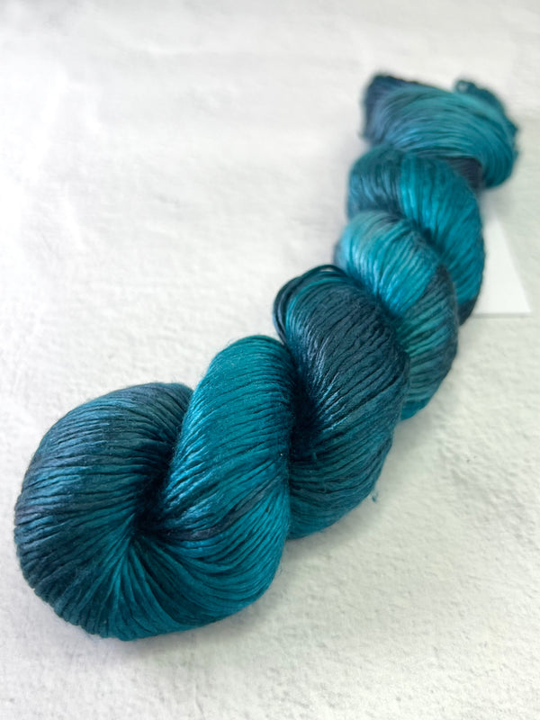 Close-up of Artyarns Regal Silk Yarn H Series in shade 7116D71A-361D-4AD7-BC99-B9A8A694CD3E, showcasing silky texture and vibrant highlights.