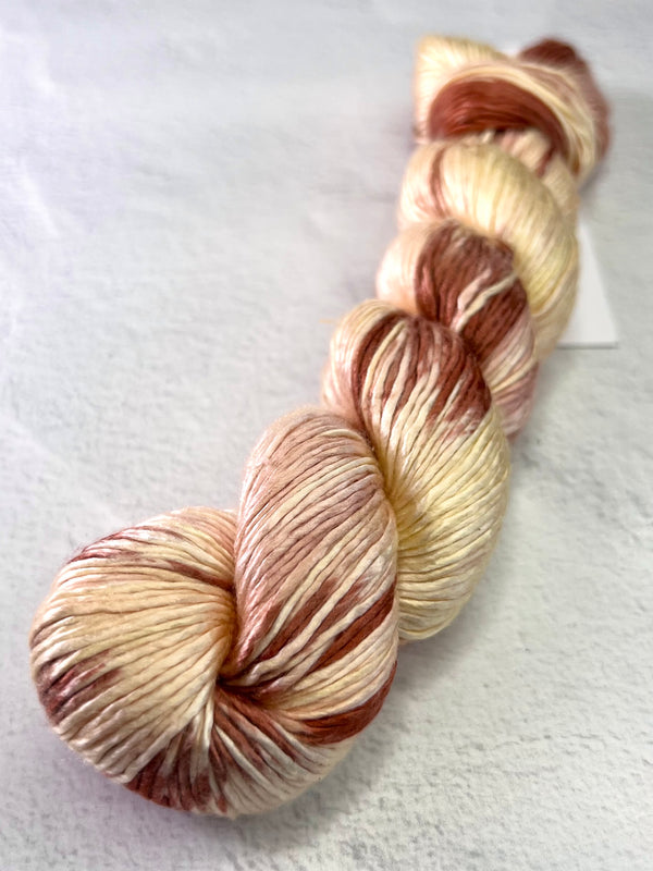 Artyarns Regal Silk Yarn H Series, close-up of shiny silk yarn with rich color highlights and smooth texture.