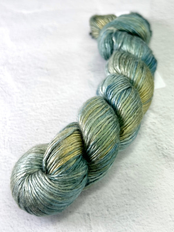 Close-up of Artyarns Regal Silk Yarn H Series in vibrant, silky fibers with rich color highlights and smooth texture.