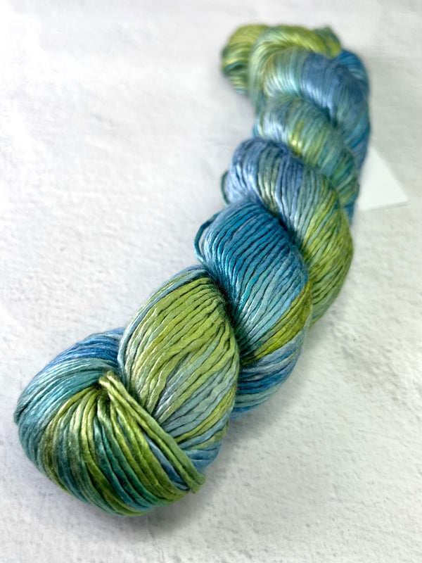 Close-up of Artyarns Regal Silk Yarn in H Series, showcasing its smooth silk texture and vibrant color highlights.