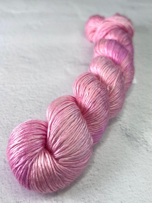 Close-up of Artyarns Regal Silk Yarn in H Series, showcasing the rich, shiny silk fibers and vibrant color highlights.