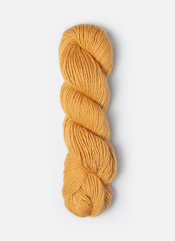 Blue Sky Fibers Suri Merino alpaca and merino yarn in soft blue color, showcasing the textured, luxurious fiber.