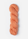 Blue Sky Fibers Suri Merino alpaca and merino yarn in a soft blue color, showcasing a close-up of the fiber texture.