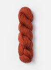 Blue Sky Fibers Suri Merino alpaca and merino yarn displayed in a skein with soft blue and natural fiber tones.
