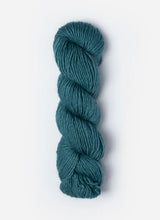 Blue Sky Fibers Suri Merino alpaca and merino yarn in soft blue color, showcasing the smooth, spun fiber strands.