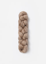 Blue Sky Fibers Metalico alpaca yarn in a soft blue shade, showcasing the textured, metallic-finished fiber.