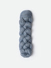 Blue Sky Fibers Metalico alpaca yarn in a soft blue color, showing the smooth, shiny texture of the fiber.